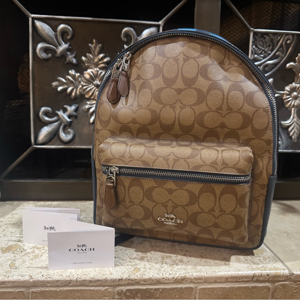 Coach Brown Backpack with Monogram Design and Rounded Top